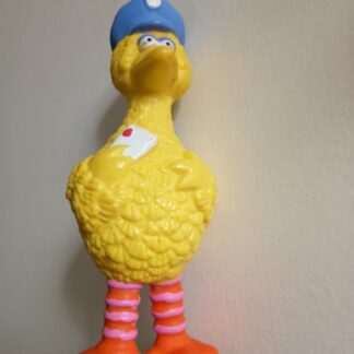 Big Bird from Sesame St dressed as a postman